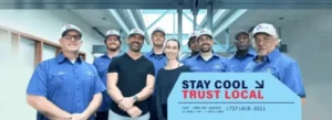 Value Air and Heat team in blue uniforms with Stay Cool Trust Local message